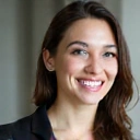 Professional portrait of a smiling woman with a clean background